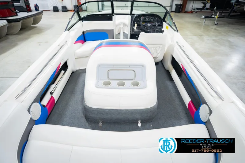 Slide: The Image of 1992 MasterCraft ProStar boat interior with white seating and colorful accents. - 15