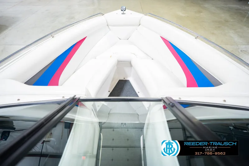 Slide: The Image of 1992 MasterCraft ProStar boat interior with white, blue, and pink upholstery. - 17
