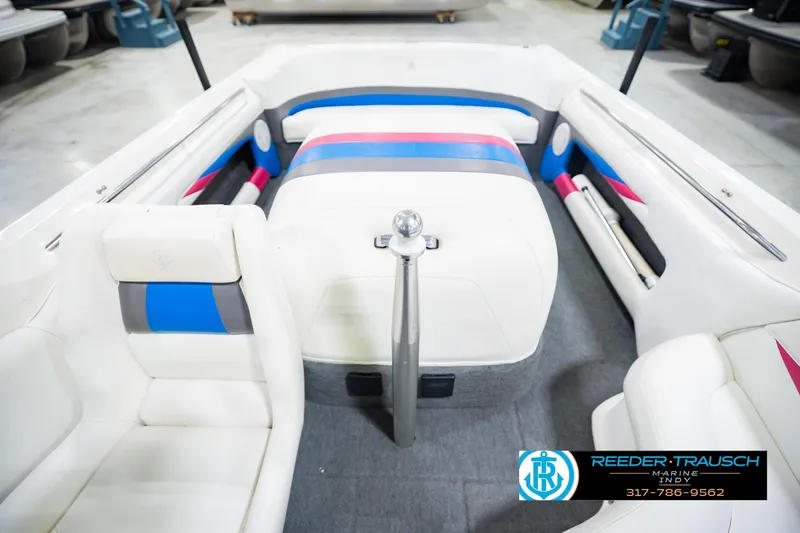 Slide: The Image of 1992 MasterCraft ProStar boat interior with white, blue, and pink seating. - 19