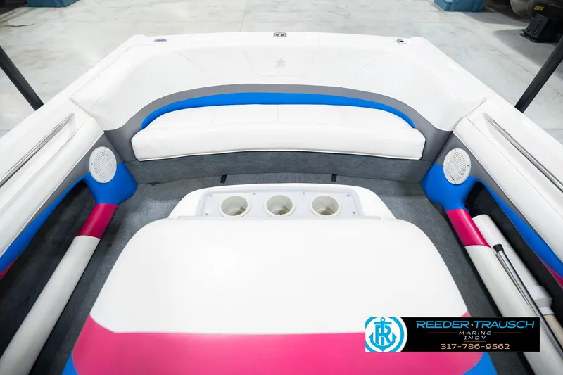 Slide: The Image of 1992 MasterCraft ProStar boat interior with colorful accents and Reeder-Trausch Marine logo. - 20
