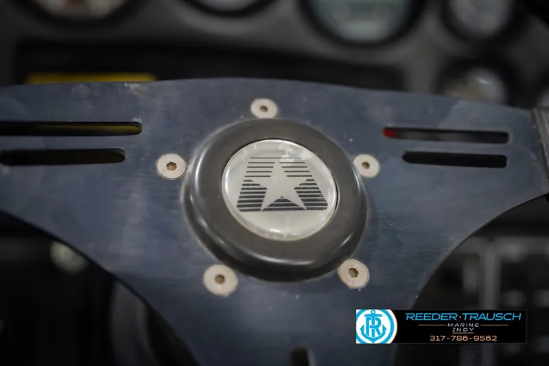 Slide: The Image of 1992 MasterCraft ProStar engine hour meter displaying 1069 hours. - 27