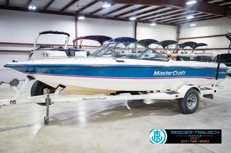 Slide: The Image of 1992 MasterCraft ProStar boat on trailer in indoor showroom. - 3