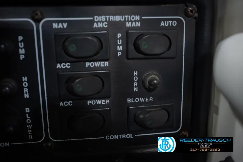 Slide: The Image of 1992 MasterCraft ProStar boat interior with white and blue seating, showcased at Reeder Trausch Marine. - 34