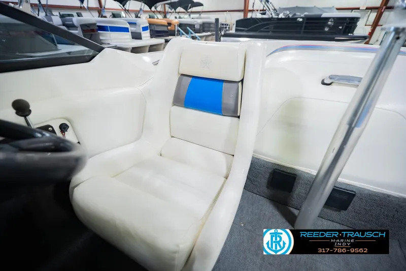 Slide: The Image of Interior seating of a 1992 MasterCraft ProStar boat with white and blue upholstery. - 36