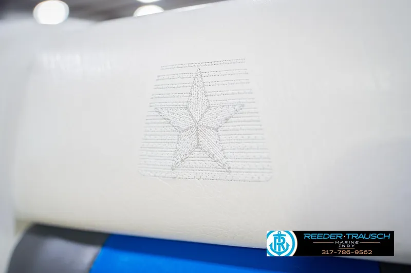 Slide: The Image of 1992 MasterCraft ProStar boat interior with white, blue, and pink upholstery. - 37