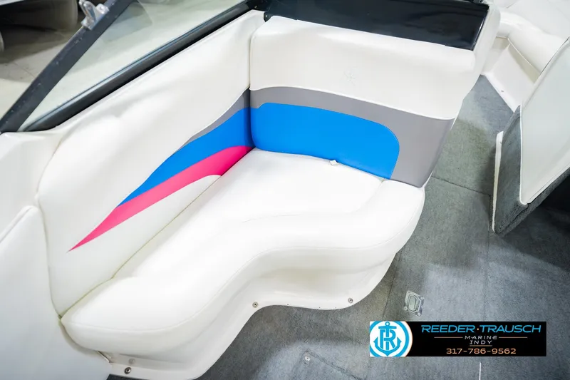 Slide: The Image of White speaker on a 1992 MasterCraft ProStar boat interior, featuring blue and gray upholstery. - 39