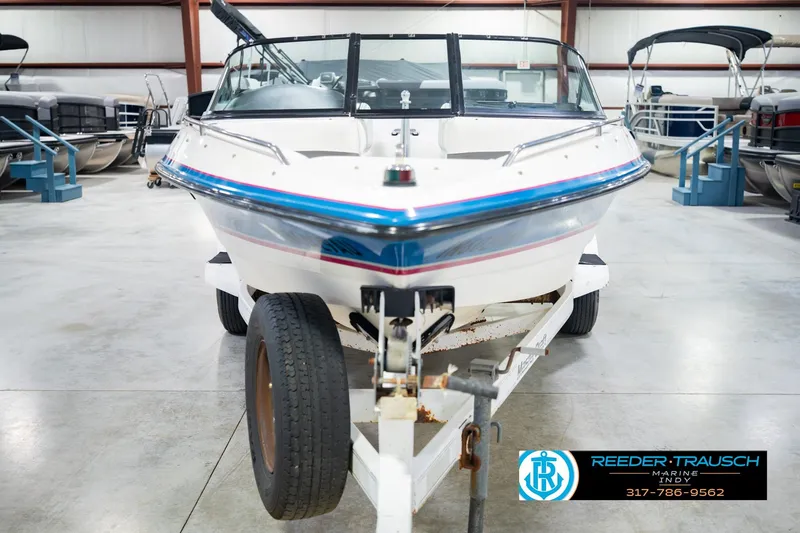 Slide: The Image of 1992 MasterCraft ProStar boat on trailer in indoor showroom. - 4