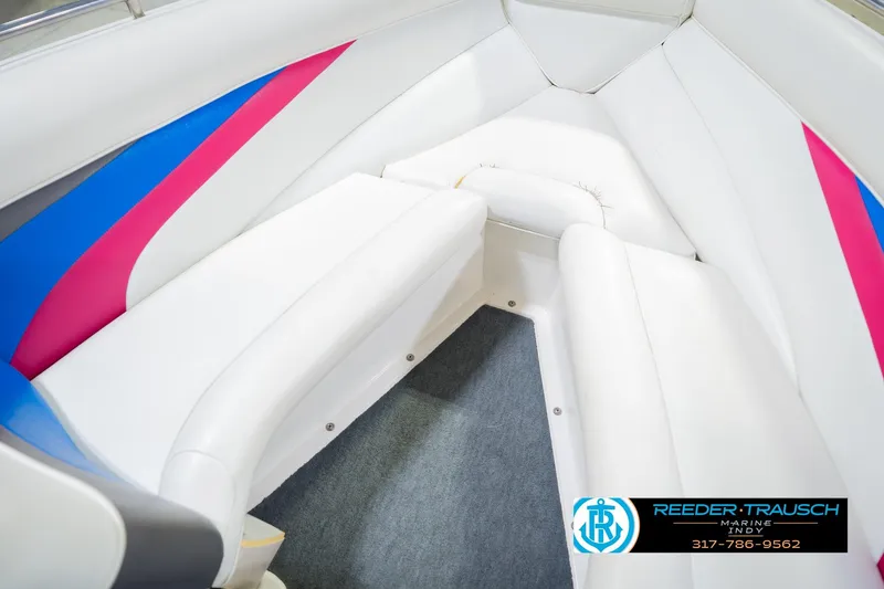 Slide: The Image of Cup holder in 1992 MasterCraft ProStar boat interior, featuring white upholstery. - 40