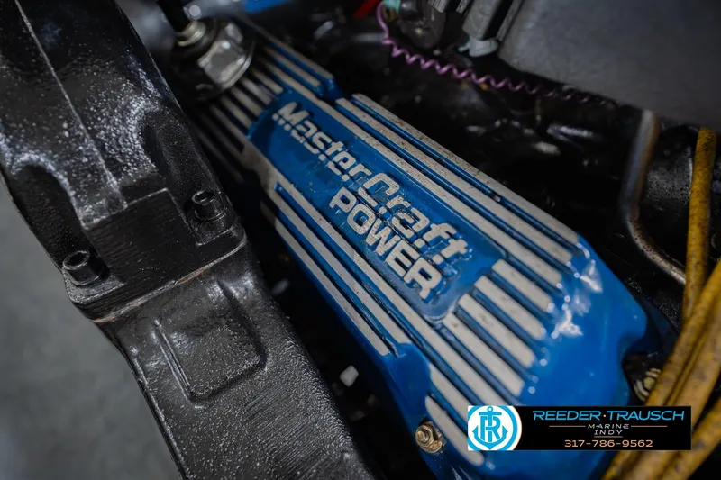 Slide: The Image of 1992 MasterCraft ProStar boat with "World Record Ski Boats" branding on blue hull. - 46