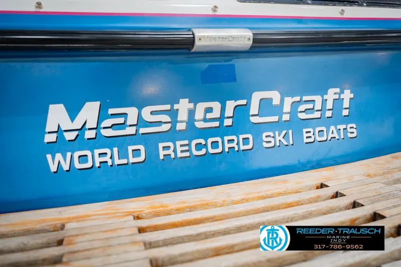 Slide: The Image of 1992 MasterCraft ProStar boat trailer hitch with visible rust and wiring. - 48