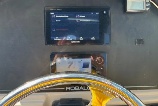 Slide: The Image of Dashboard of 2016 Robalo R247 Dual Console with Garmin navigation system. - 12