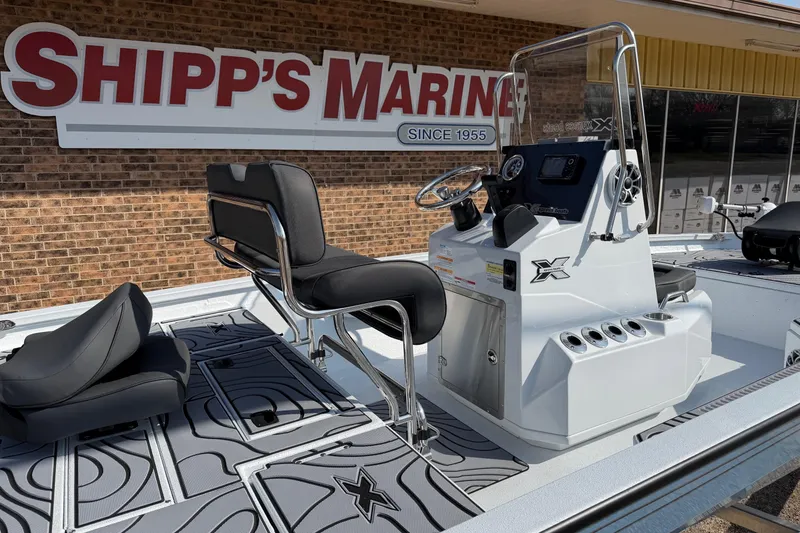 Slide: The Image of 2026 Xpress H20B Bay boat at Shipp's Marine dealership, featuring sleek design and modern controls. - 3