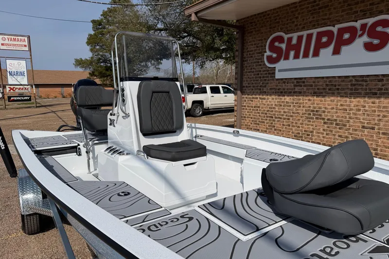 Slide: The Image of 2026 Xpress H20B Bay boat displayed at Shipp's Marine dealership. - 5
