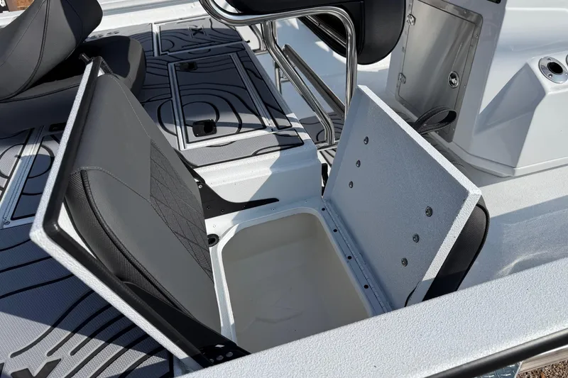 Slide: The Image of 2026 Xpress H20B Bay boat interior with open storage compartment and seating. - 7