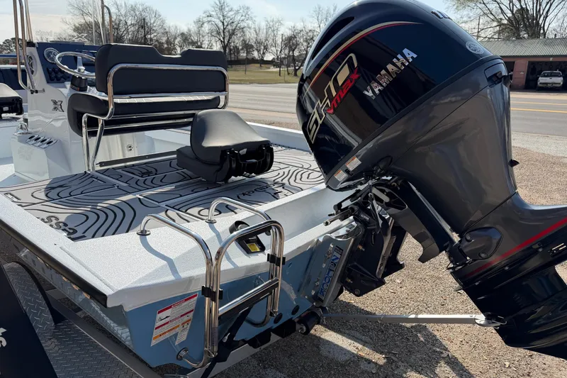 Slide: The Image of 2026 Xpress H20B Bay boat with Yamaha VMAX engine, parked outdoors. - 8