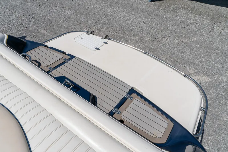 Slide: The Image of Rear deck of a 2007 Bryant 190 boat with sleek design and wood accents. - 25