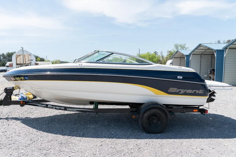 Slide: The Image of 2007 Bryant 190 boat on trailer, parked outdoors under clear sky. - 4