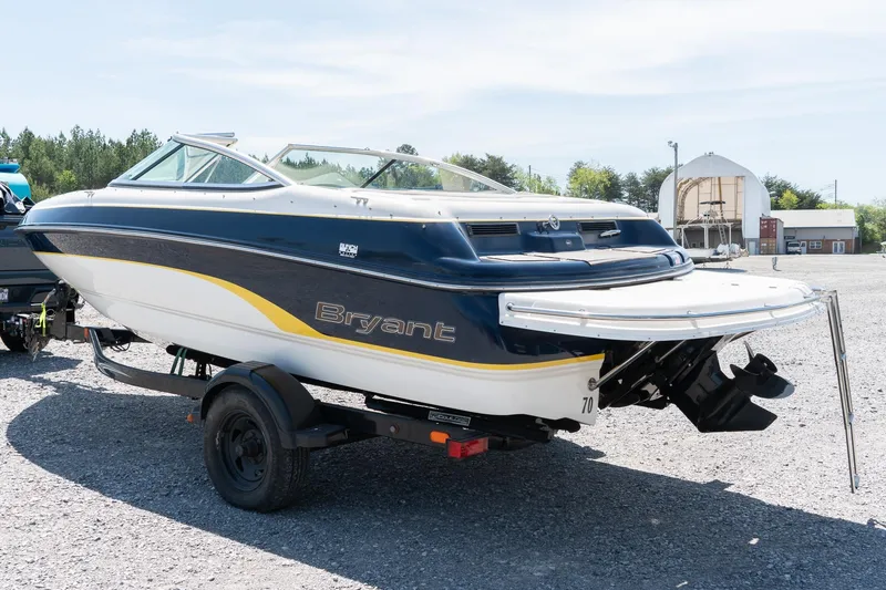 Slide: The Image of 2007 Bryant 190 boat on trailer, parked outdoors on gravel lot. - 5