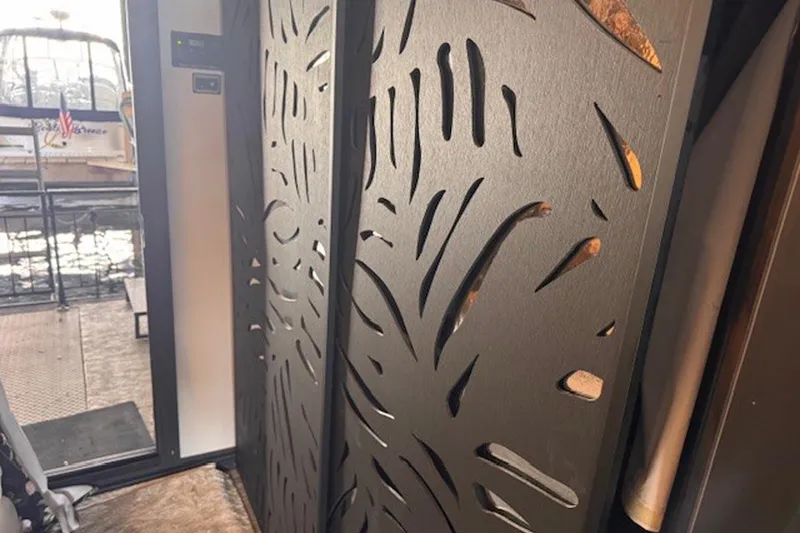 Slide: The Image of Interior of 1985 Three Buoys houseboat with decorative paneling and dock view. - 19