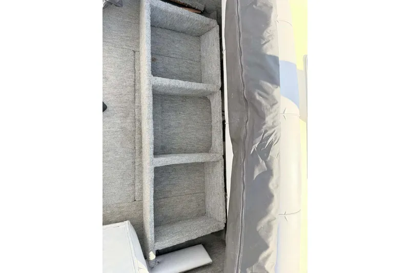 Slide: The Image of 2008 Landau Atlantis 250 Sport Cruise boat interior storage compartments. - 10