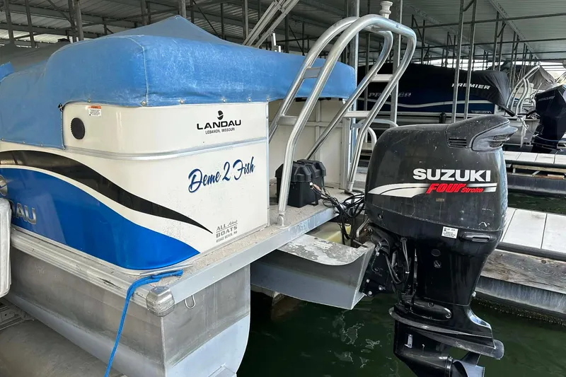 Slide: The Image of 2008 Landau Atlantis 250 Sport Cruise boat with Suzuki Four Stroke engine in marina. - 20