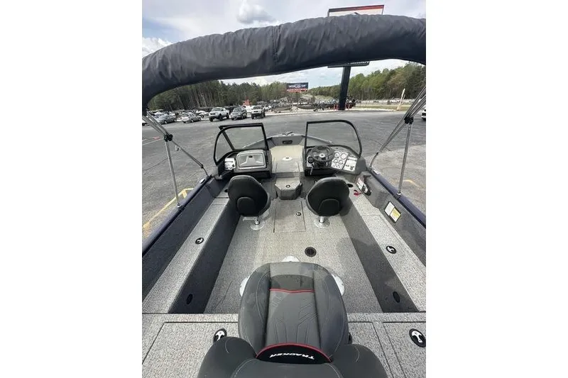 Slide: The Image of 2024 Tracker Pro Guide V-175 WT boat interior with dual consoles and seating. - 2