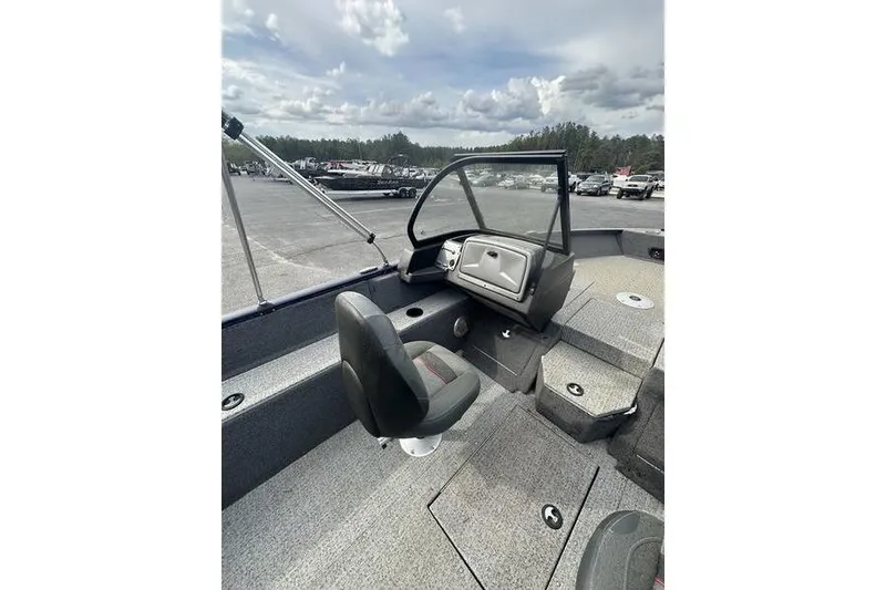 Slide: The Image of 2024 Tracker Pro Guide V-175 WT boat interior with seating and dashboard. - 4