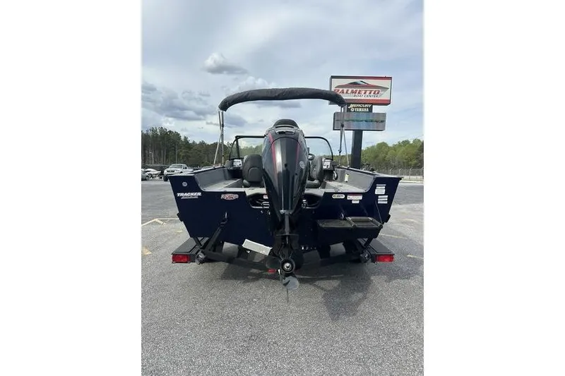 Slide: The Image of 2024 Tracker Pro Guide V-175 WT boat, rear view, parked outdoors on a trailer. - 7