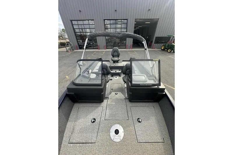 Slide: The Image of 2024 Tracker Pro Guide V-175 WT boat interior with dual consoles and seating. - 8