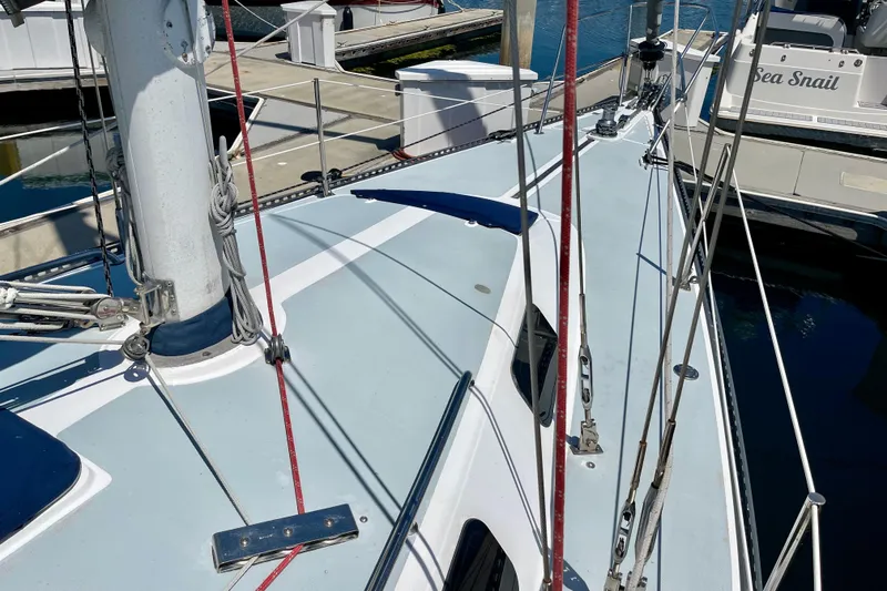 Slide: The Image of 1979 Catalina 38 sailboat deck with rigging at marina. - 12