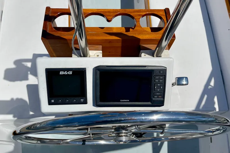Slide: The Image of Steering console of a 1979 Catalina 38 sailboat with B&G and Garmin displays. - 21