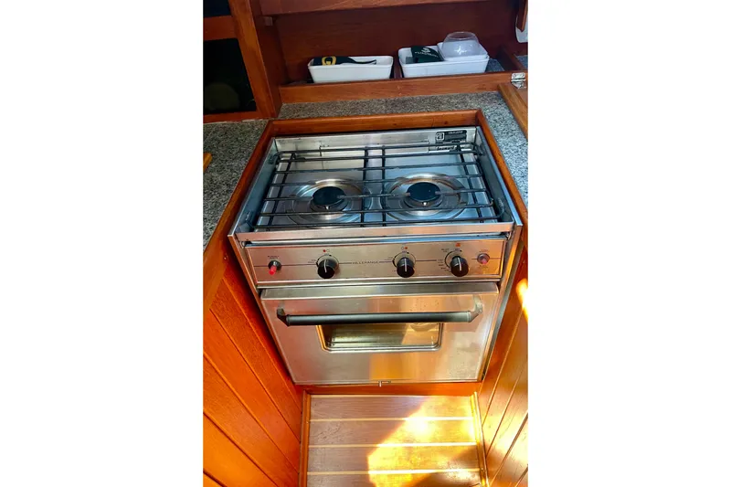 Slide: The Image of Stainless steel stove and oven in 1979 Catalina 38 yacht kitchen. - 31
