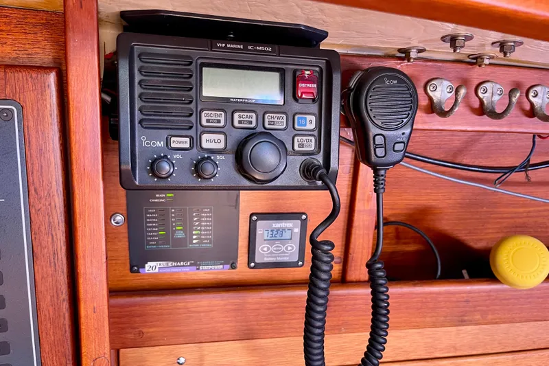Slide: The Image of VHF marine radio setup on 1979 Catalina 38 sailboat, featuring Icom IC-M502. - 40