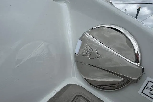 Slide: The Image of 2025 Crownline 280 SS boat detail showing a sleek chrome fuel cap design. - 17