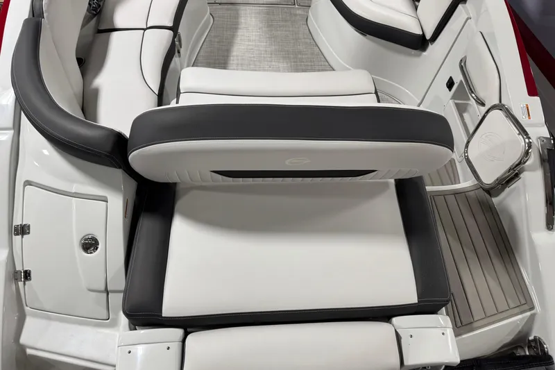 Slide: The Image of 2025 Crownline 280 SS boat interior with sleek white and black seating design. - 19