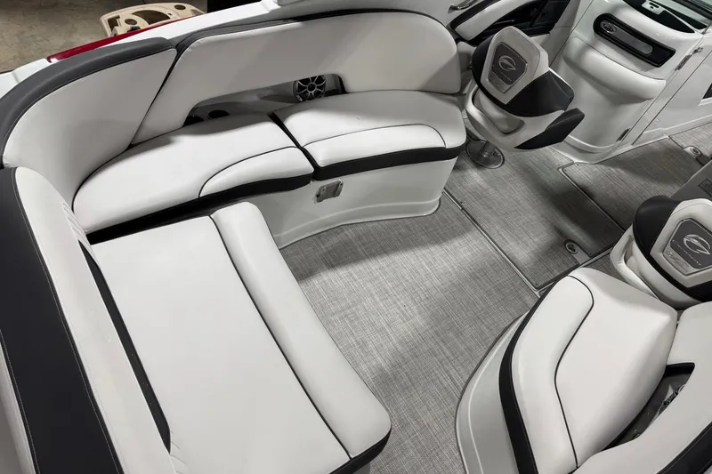 Slide: The Image of 2025 Crownline 280 SS boat interior with sleek white seating and modern design. - 20