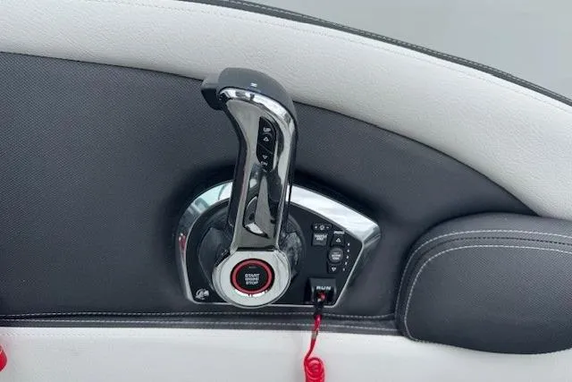 Slide: The Image of Throttle control panel of 2025 Crownline 280 SS boat, featuring sleek chrome finish. - 23