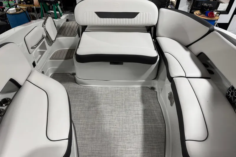 Slide: The Image of 2025 Crownline 280 SS boat interior with sleek white seating and modern design. - 24