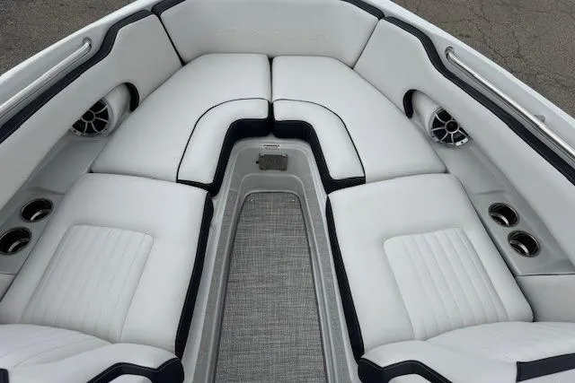 Slide: The Image of Luxurious 2025 Crownline 280 SS boat interior with plush white seating and cup holders. - 27