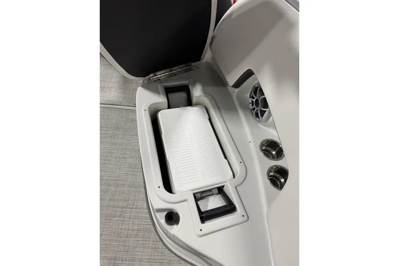 Slide: The Image of Interior view of 2025 Crownline 280 SS boat with built-in cooler and cup holders. - 29