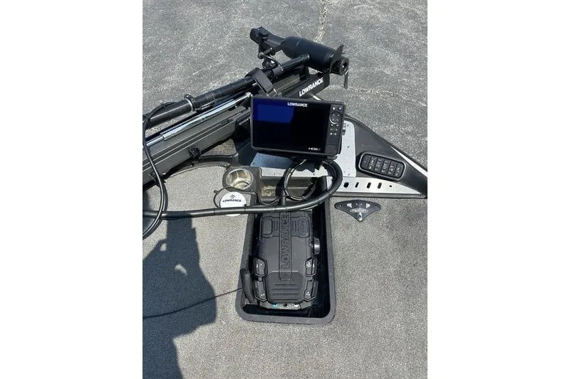 Slide: The Image of 2016 Triton 20 TrX boat dashboard with Lowrance fishfinder and control panel. - 7