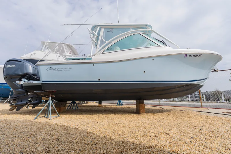 The Image of 2022 Albemarle 27 DC boat on stands, side view. - 0