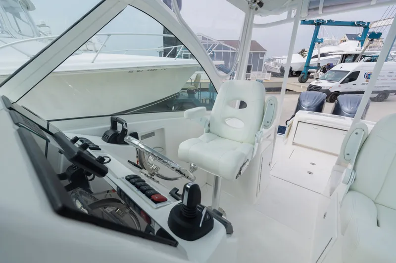 Slide: The Image of Interior of a 2022 Albemarle 27 DC boat, modern helm station. - 10