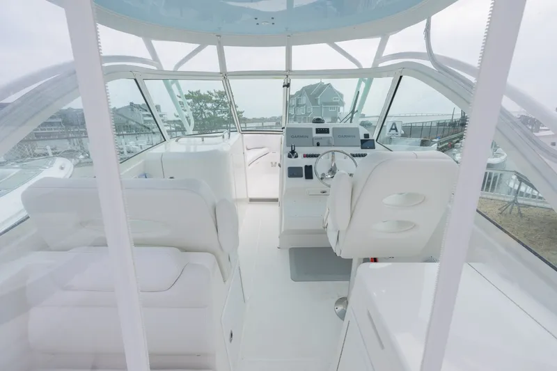 Slide: The Image of Interior of 2022 Albemarle 27 DC with modern helm console. - 12