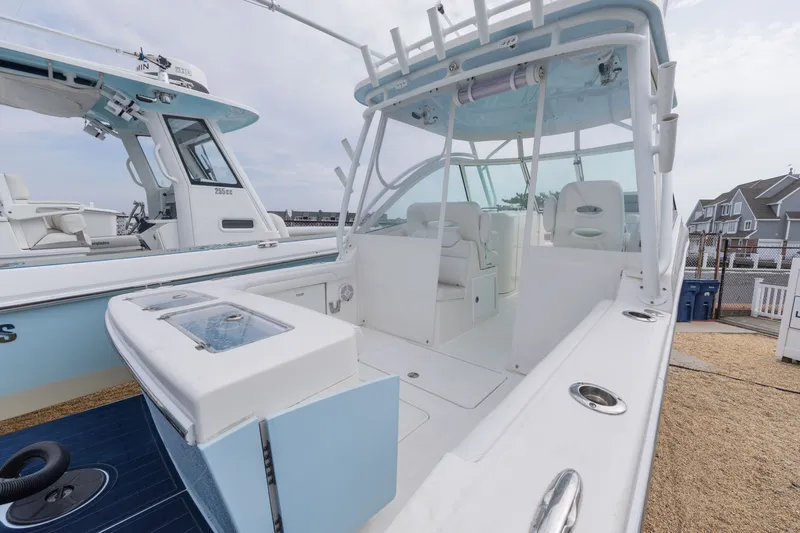 Slide: The Image of 2022 Albemarle 27 DC boat with spacious deck and seating area. - 14