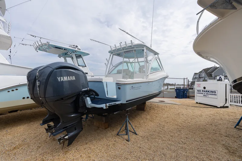 Slide: The Image of 2022 Albemarle 27 DC boat with Yamaha engine on gravel lot. - 16