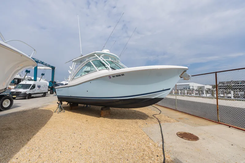 Slide: The Image of 2022 Albemarle 27 DC boat on dry dock, side view. - 2