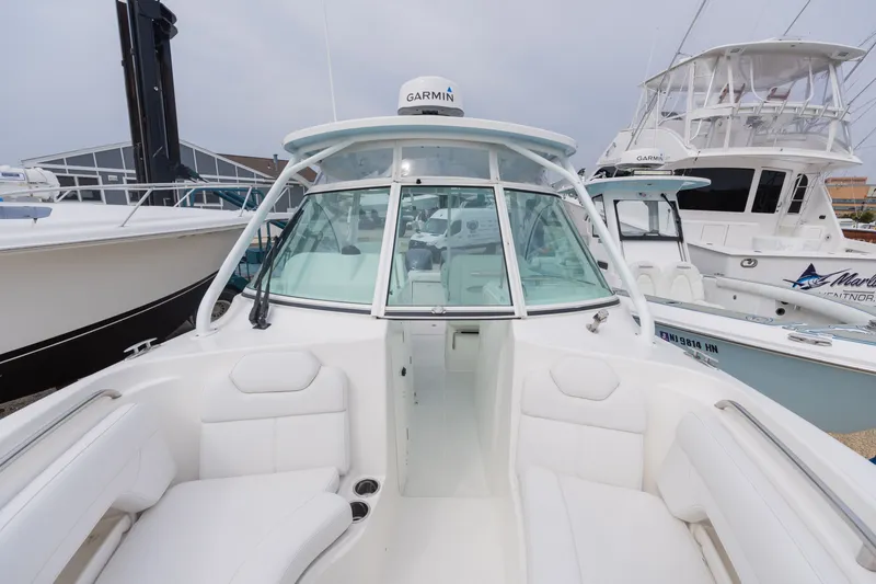 Slide: The Image of Albemarle 27 DC 2022 boat with white interior and Garmin equipment. - 7