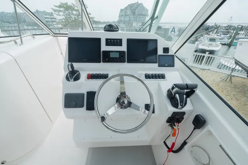 Slide: The Image of 2022 Albemarle 27 DC helm with modern electronics. - 9