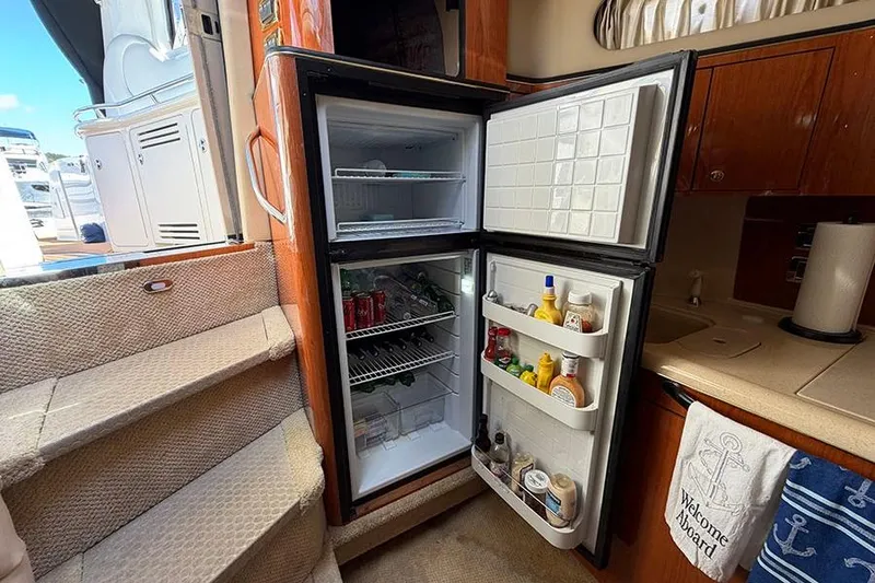 Slide: The Image of Open refrigerator in 2001 Sea Ray 410 Express Cruiser yacht kitchen interior. - 16